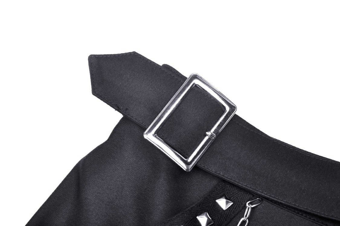 Close-up of the buckle detail on a black gothic mini skirt with studded accents.