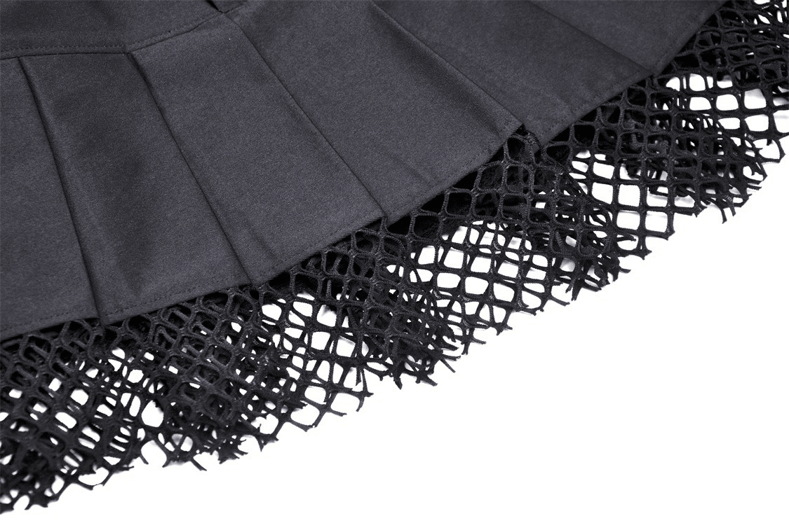 Gothic black mini skirt featuring pleated fabric with a dramatic studded mesh overlay.
