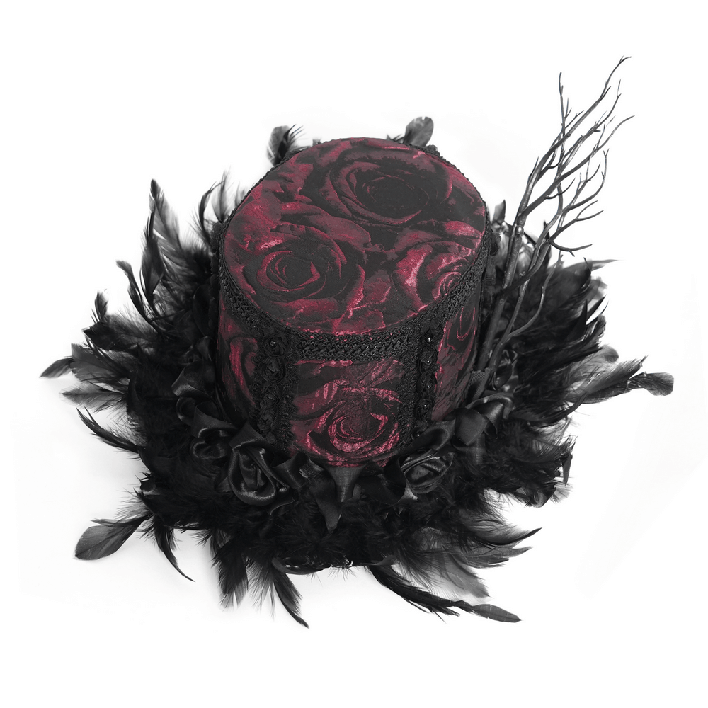 Gothic mini top hat with black feathers, red rose brocade, and lace, perfect for Victorian-themed events.