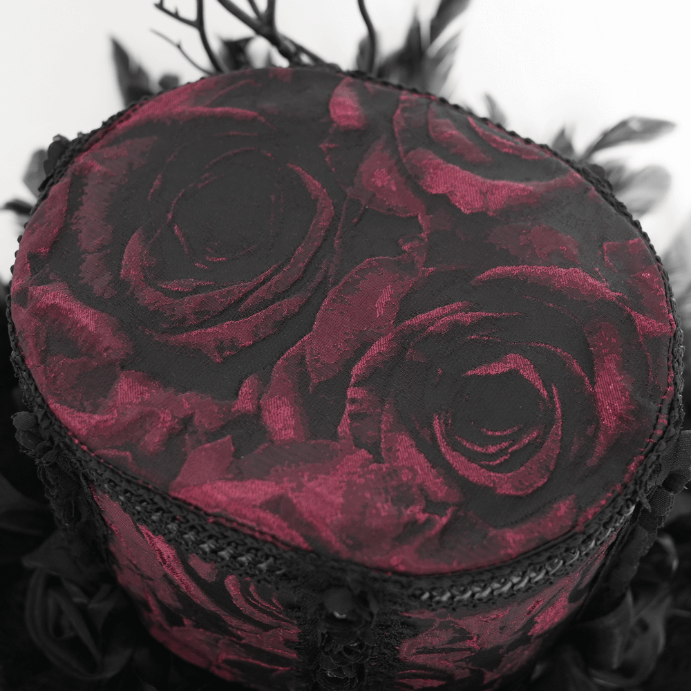 Gothic mini top hat with deep red rose brocade and black lace details, perfect for adding elegance to any outfit.
