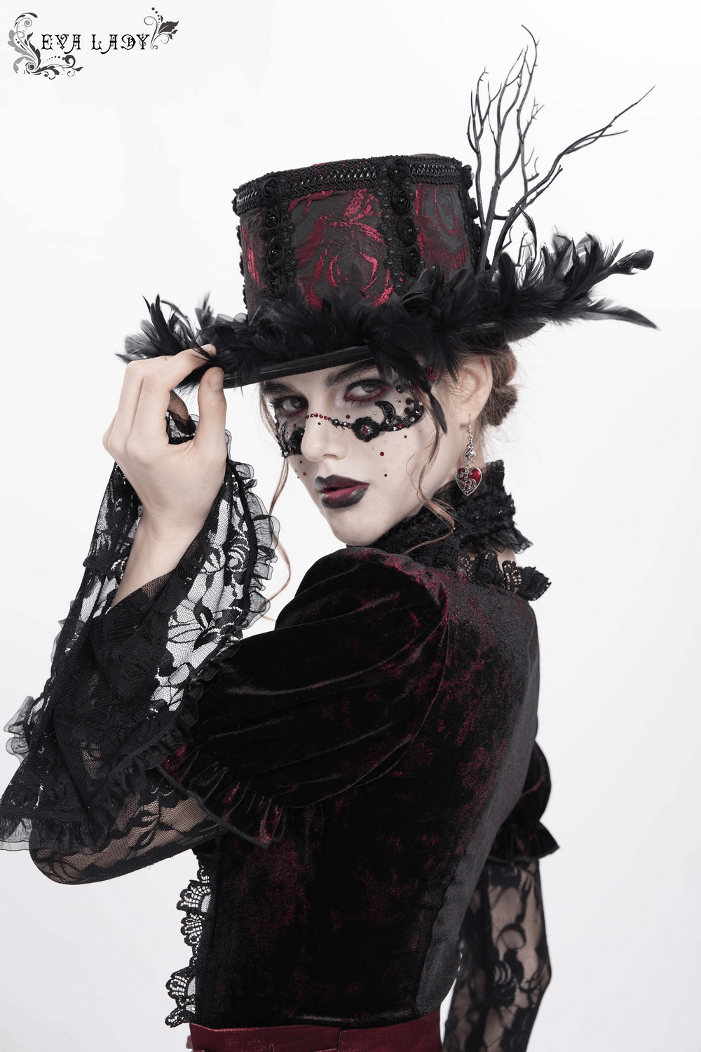 Gothic mini top hat with black feathers and rose brocade, perfect for Victorian, burlesque, and cosplay style.