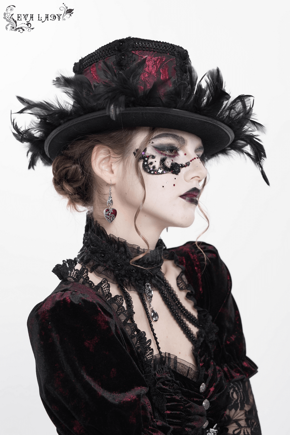 Gothic mini top hat with black feathers and rose brocade, styled for Victorian women's fashion.