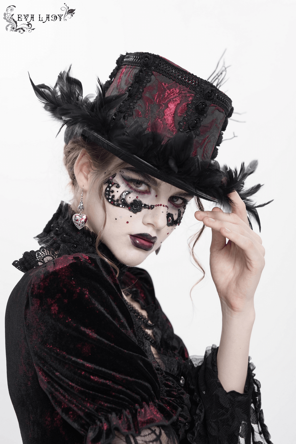 Gothic mini top hat with black feathers, rose brocade; perfect for Victorian and burlesque fashion.