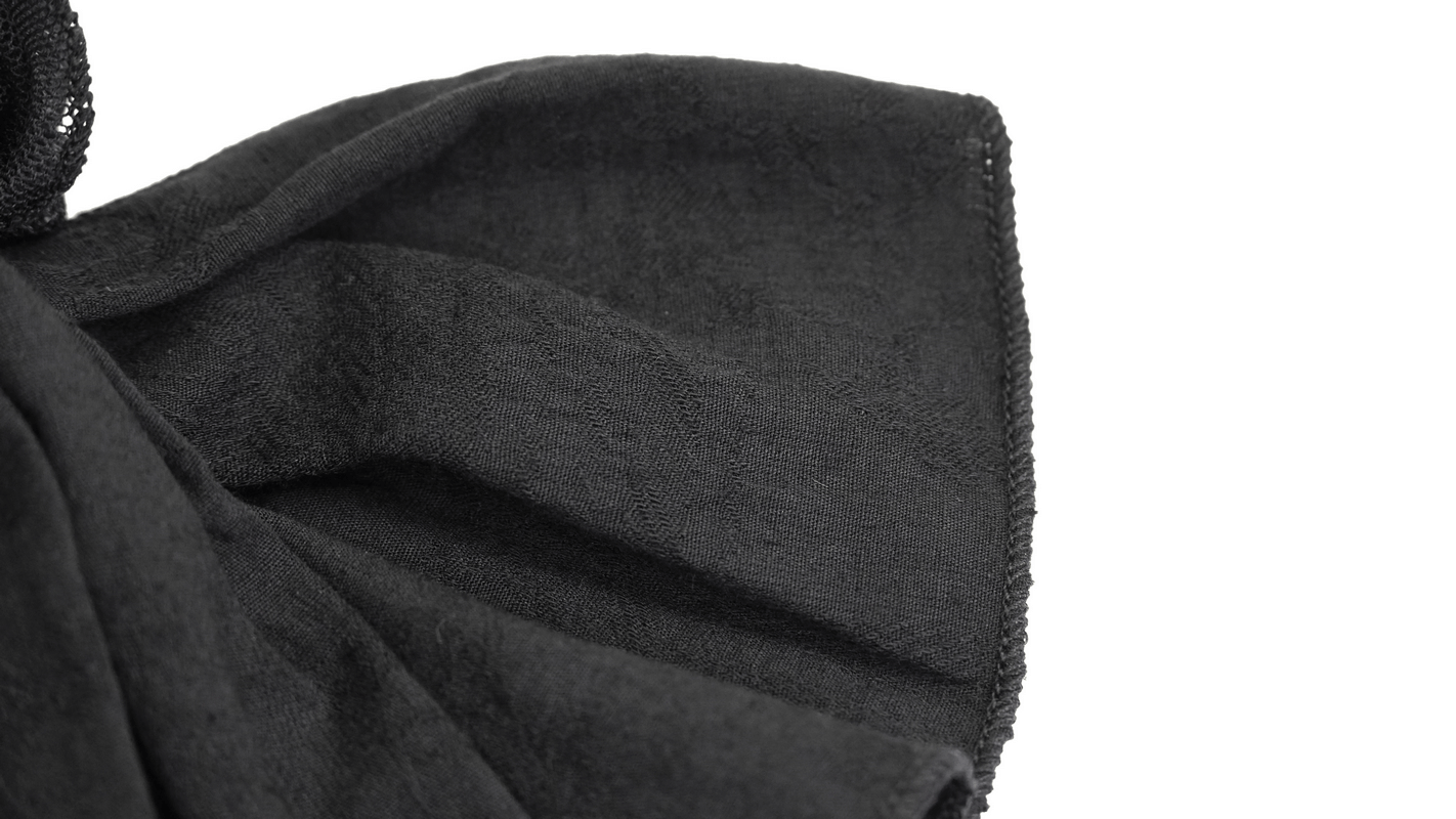Close-up of black gothic bow tie fabric showcasing elegant, vintage texture and soft folds.