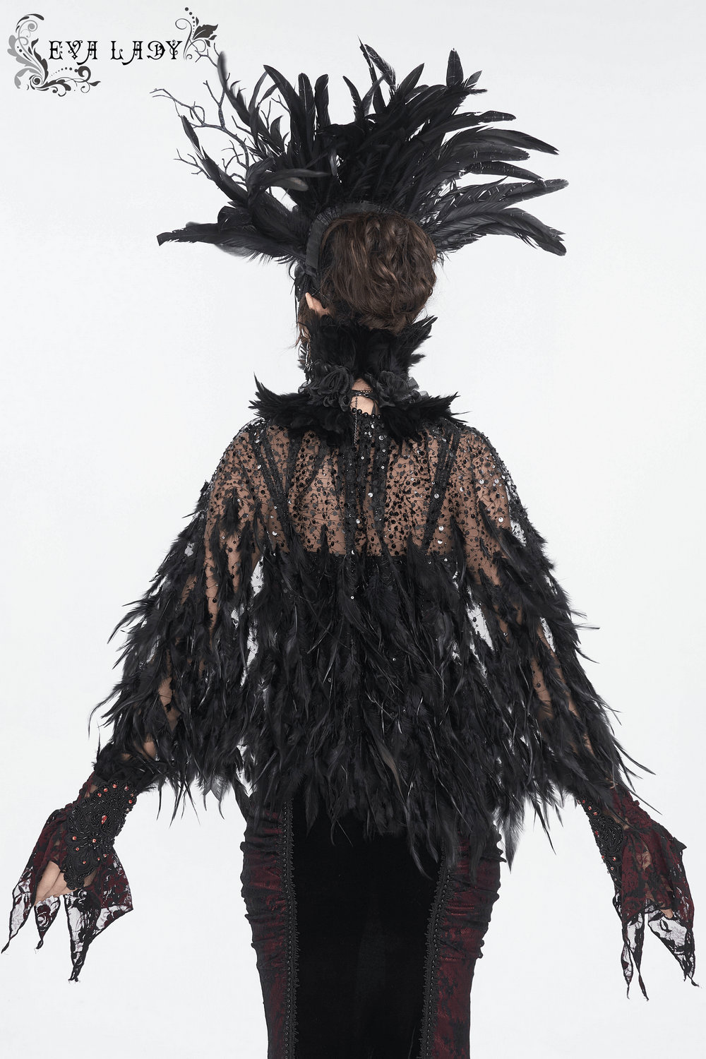 Elegant Gothic Noir feather crown with floral accents, worn by model in stunning black outfit, perfect for special events.