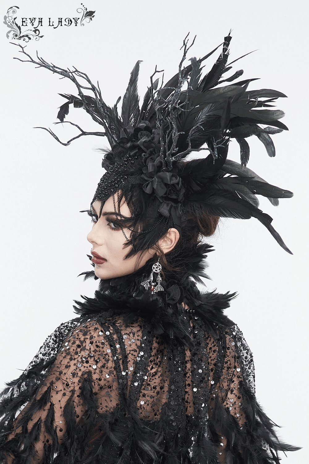 Elegant Gothic Noir feather crown with floral accents worn at a special event.