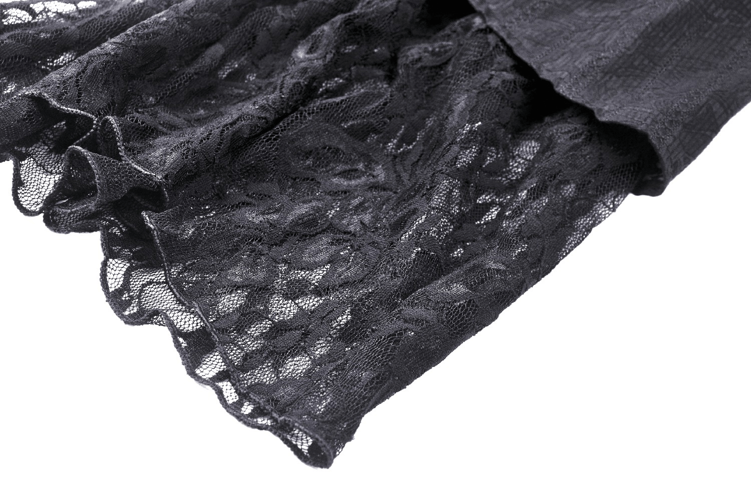 Close-up of black lace fabric featuring intricate patterns from a Gothic corset dress.