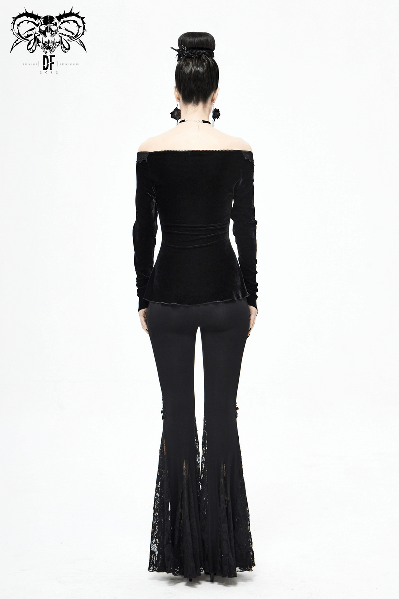 Back view of a woman in a gothic off-shoulder black velvet top paired with flared lace pants.