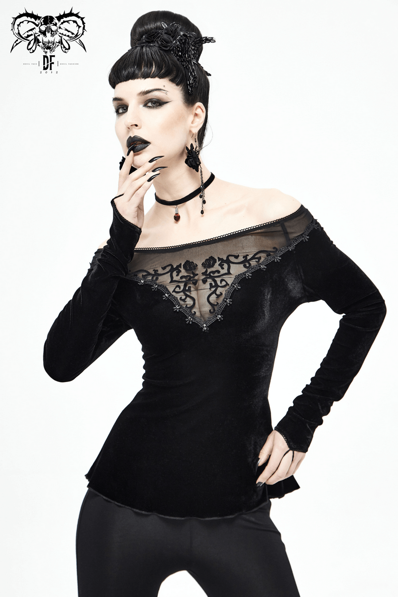 Elegant model in a gothic off-shoulder black velvet top with floral embroidery and vintage lace details.