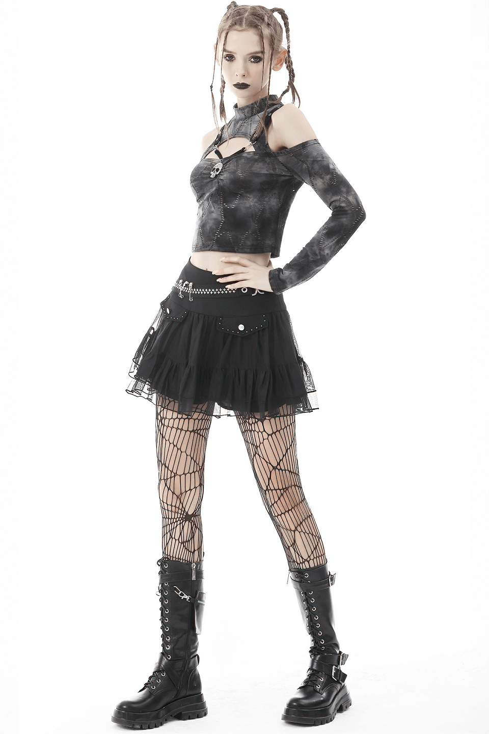 Gothic off-shoulder long sleeve top paired with a black tulle skirt, fishnet stockings, and combat boots.