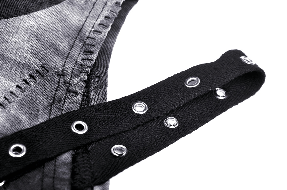 Close-up of edgy off-shoulder top detail with black straps and silver grommets for a punk rock vibe.