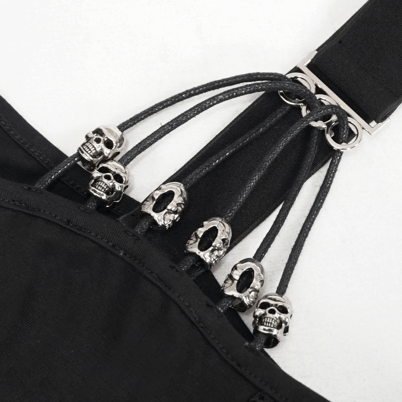 Detail of black gothic top featuring skull accents and mesh straps for a trendy edgy look.