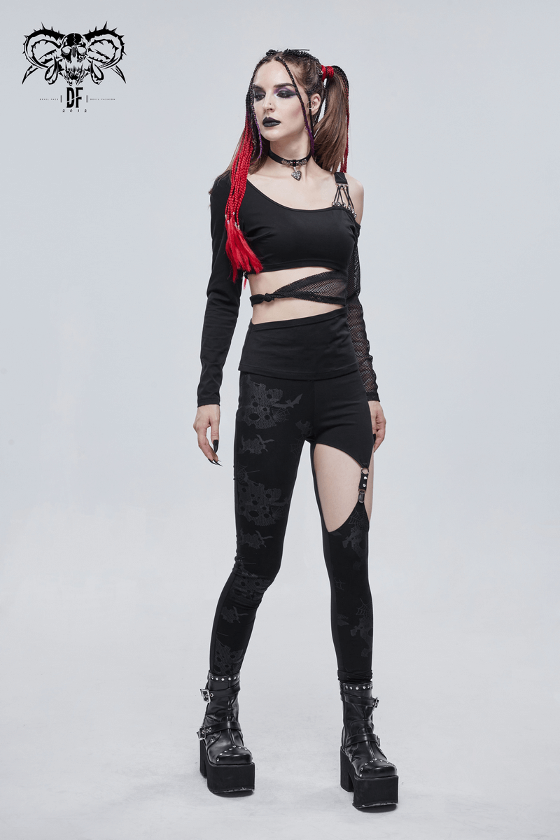 Gothic off-shoulder black top with mesh sleeves, stylish cutouts, paired with black leggings, showcasing edgy fashion.