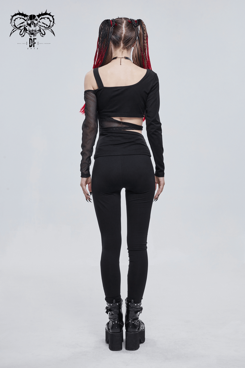 Woman wearing a Gothic off-shoulder black mesh splice top with stylish cutouts and fitted black leggings.