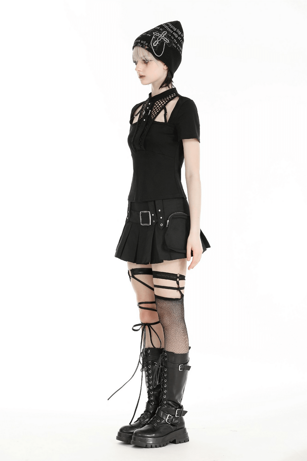 Model showcasing a Gothic off-shoulder mesh top with metal accents, paired with a short skirt and chunky black boots.