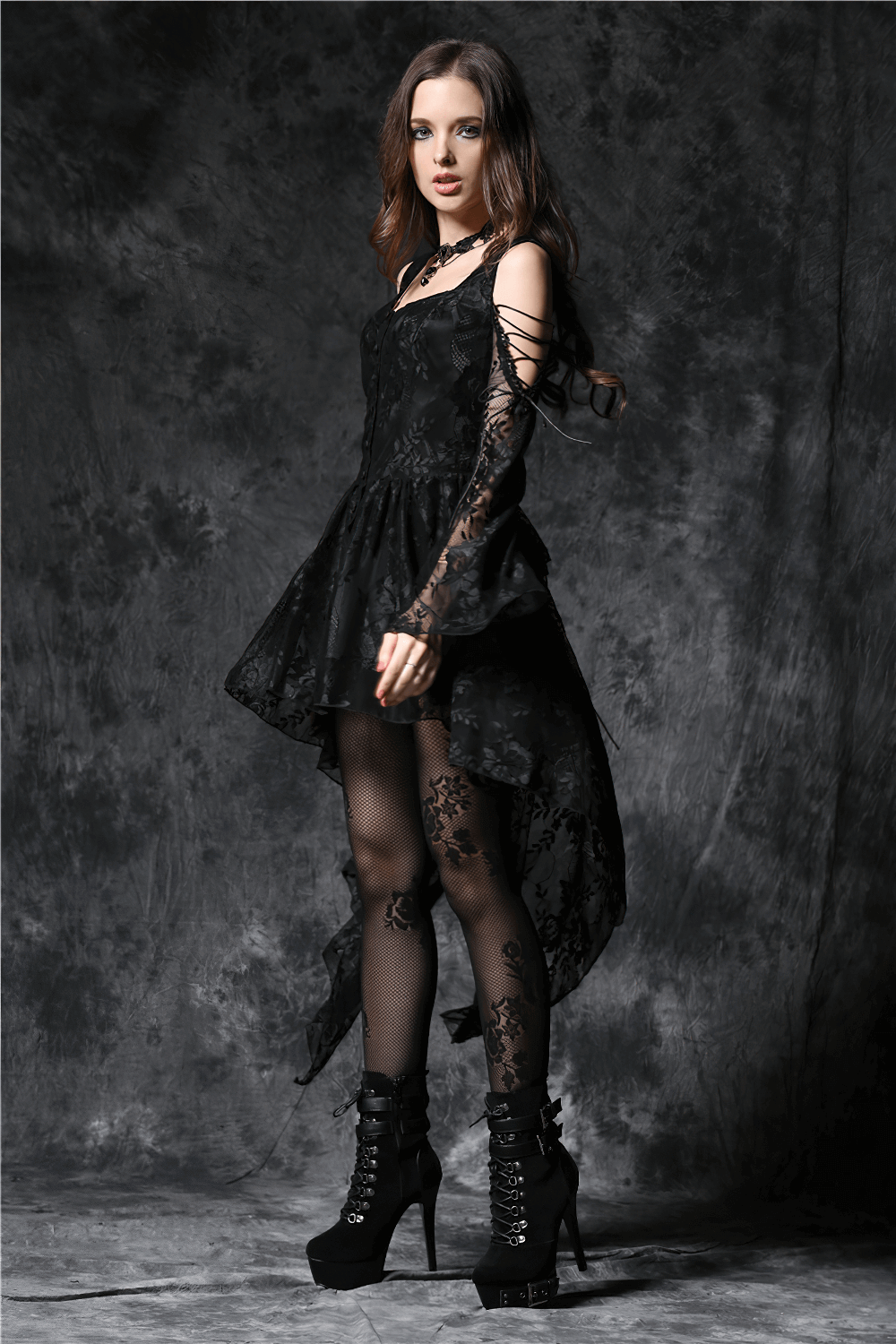 Gothic off-the-shoulder lace dress with long sleeves and high-low skirt, perfect for a dramatic night out.