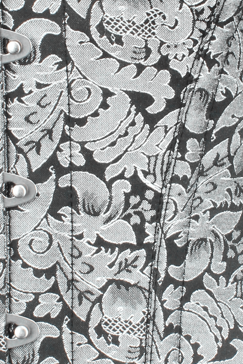 Close-up of a Gothic overbust corset with intricate silver floral design and steel boning for tight lacing.