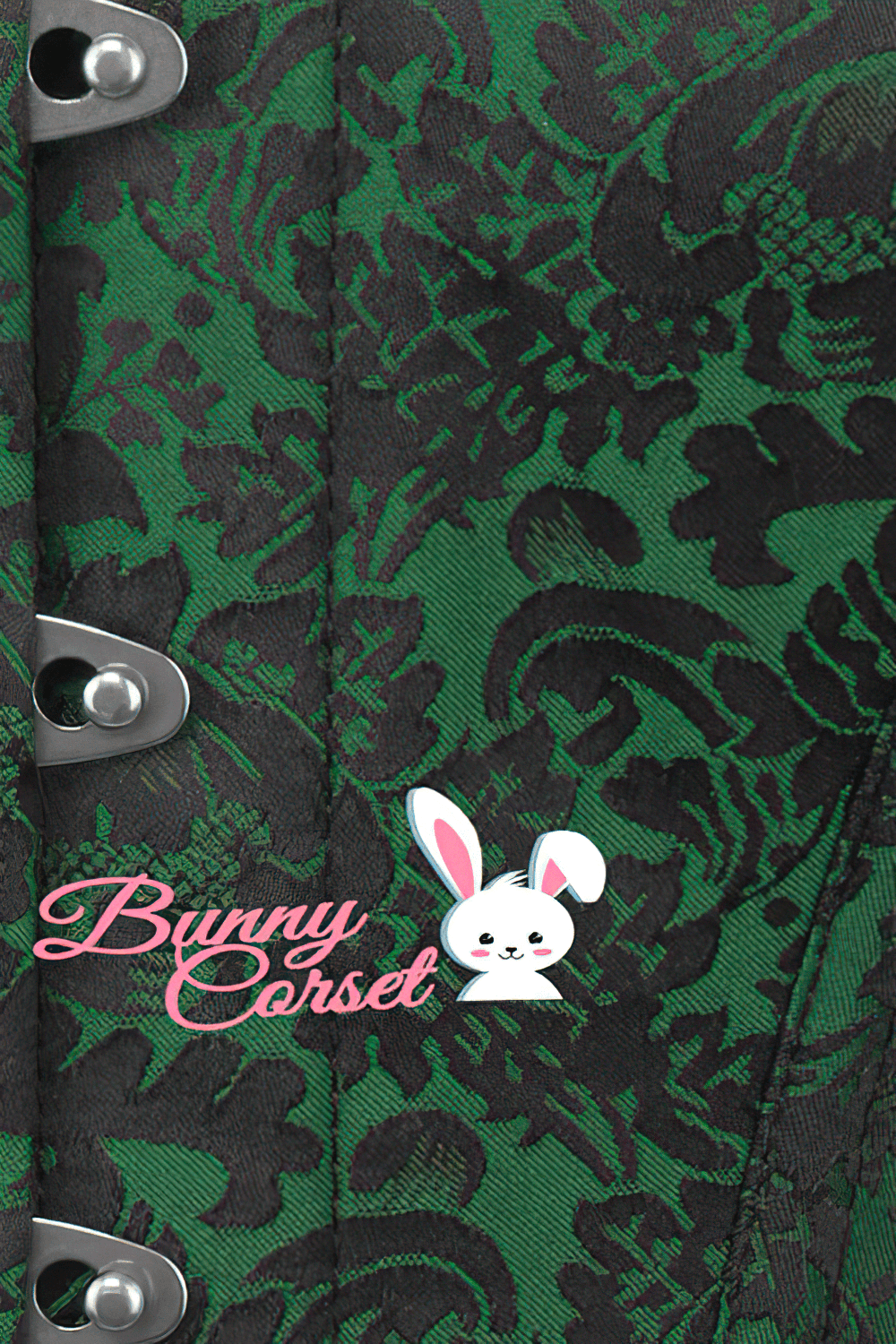 Close-up of a gothic overbust corset in green brocade, featuring metal busk closures and Bunny Corset logo.