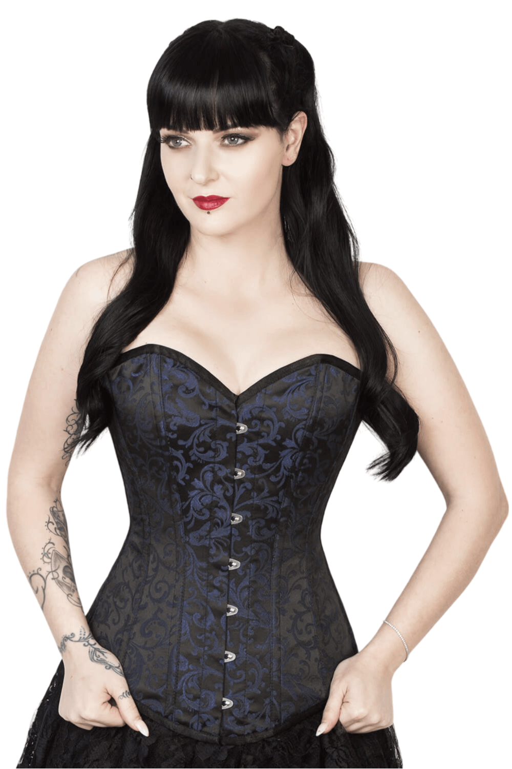 Gothic overbust corset in brocade fabric with steel boning, worn by model with dark hair and red lips.