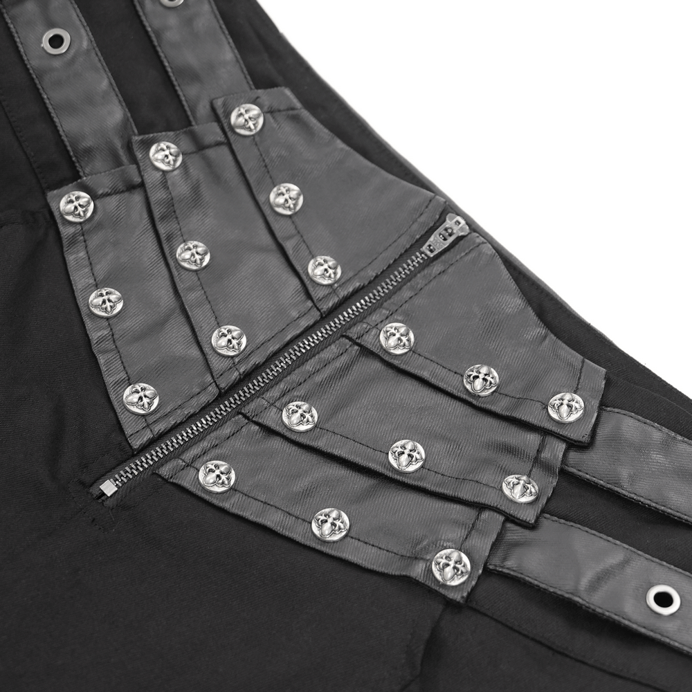 Close-up of gothic pants with leather straps, metal studs, and zipper details for a bold streetwear look.