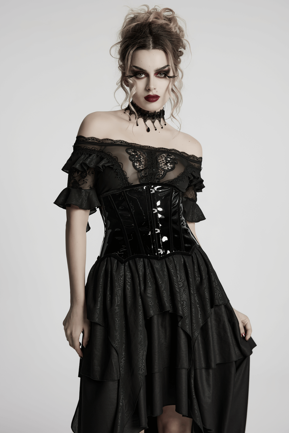 Gothic model in a patent leather lace-up corset with ruffled black dress, showcasing edgy elegance and dramatic style.