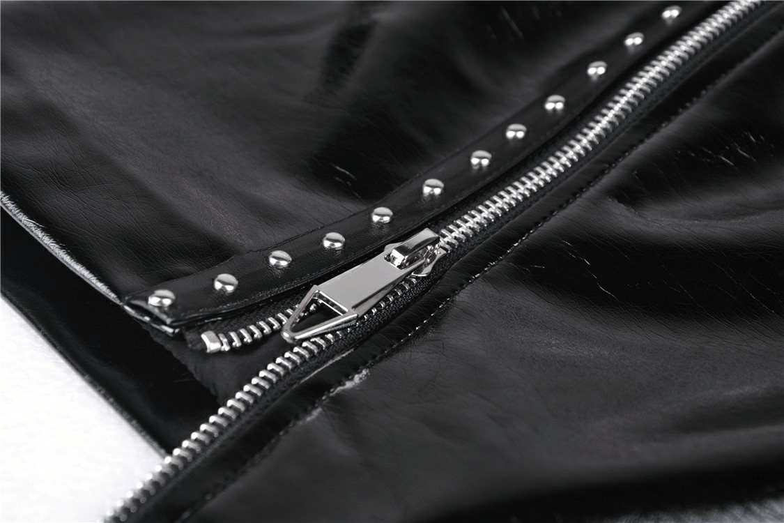 Close-up of a gothic black patent leather mini skirt zipper with studded detailing and shiny metal accents.