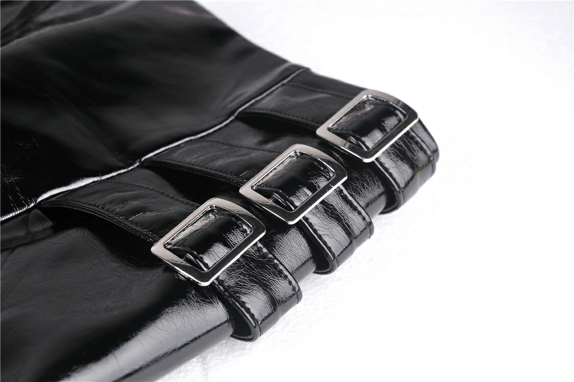 Close-up of black patent leather mini skirt featuring stylish buckle detailing for a bold gothic look.