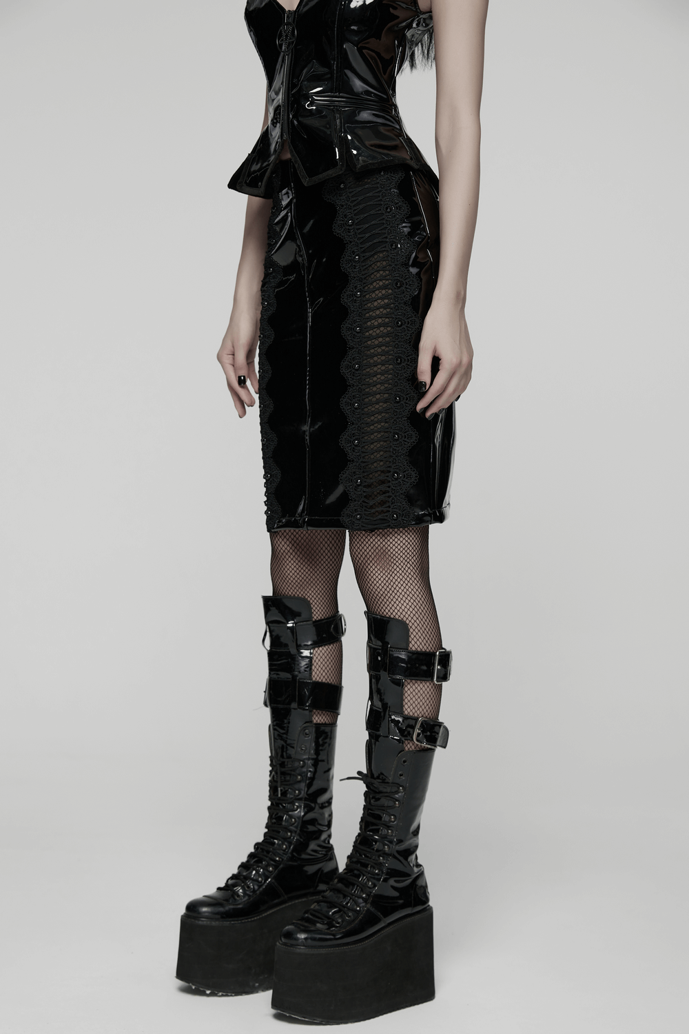 Gothic Patent Leather Skirt with Lace and Rivet Details worn with a stylish corset and platform boots.