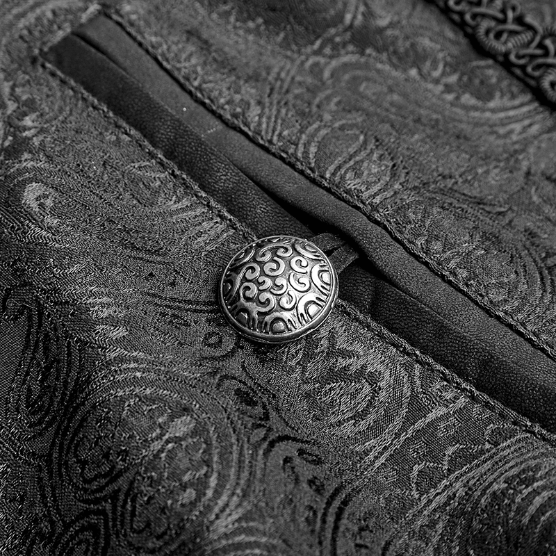 Close-up of ornate peacock button on gothic jacquard trousers, showcasing elegant detailing and luxurious fabric.