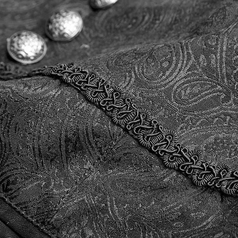 Close-up of Gothic jacquard fabric with ornate peacock buttons and intricate detailing.