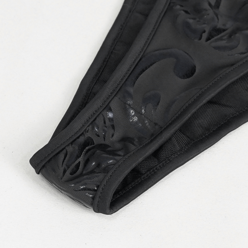Close-up of black bikini set showcasing intricate gothic pattern and chic design elements.