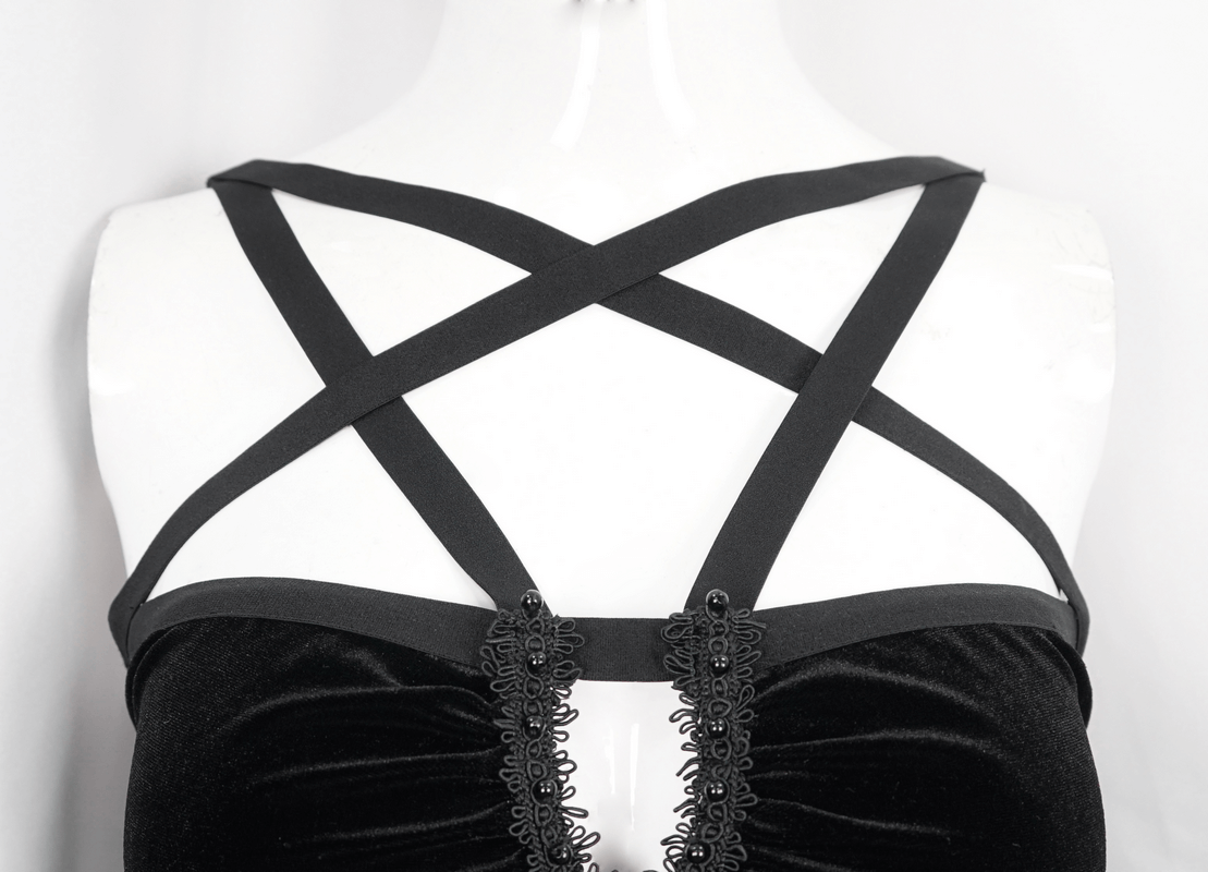 Close-up of gothic pentagram strappy dress showing intricate black straps and elegant back design.