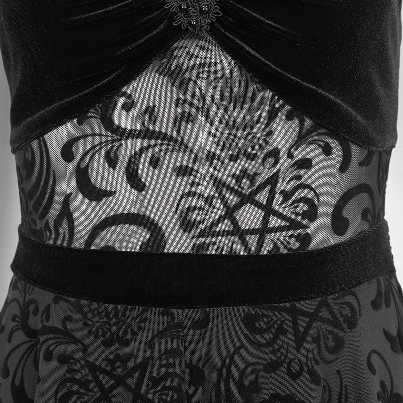 Close-up of a black gothic dress featuring pentagram detail and intricate mesh patterns.