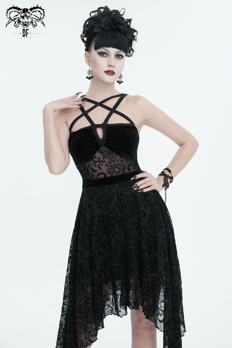 Elegant woman in black gothic pentagram strappy dress with an asymmetrical cut and vintage style.