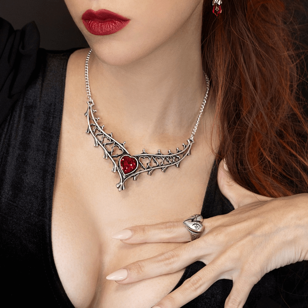 Gothic Pewter Broken Heart and Mystical Sigil Ring worn with a striking red necklace, showcasing dark elegance.