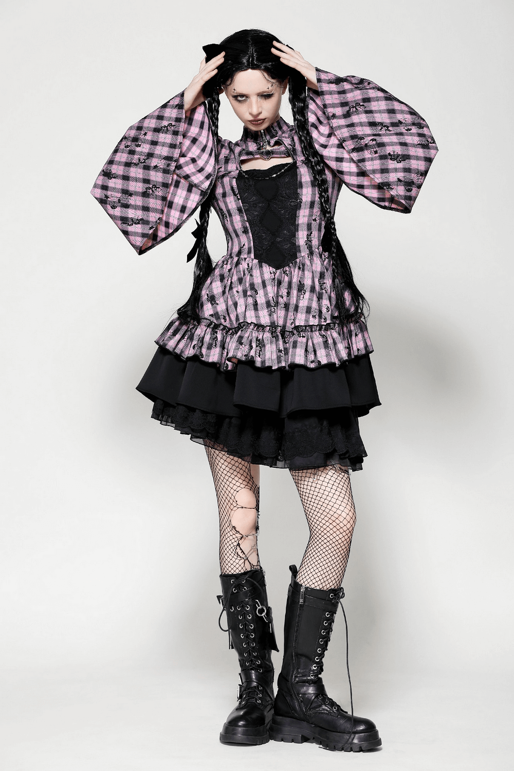 Gothic plaid bell-sleeve dress with lace details, styled with fishnet tights and combat boots for edgy elegance.