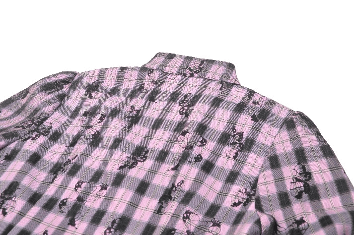 Back view of gothic plaid dress featuring black lace and skull prints on soft pink checkered fabric.