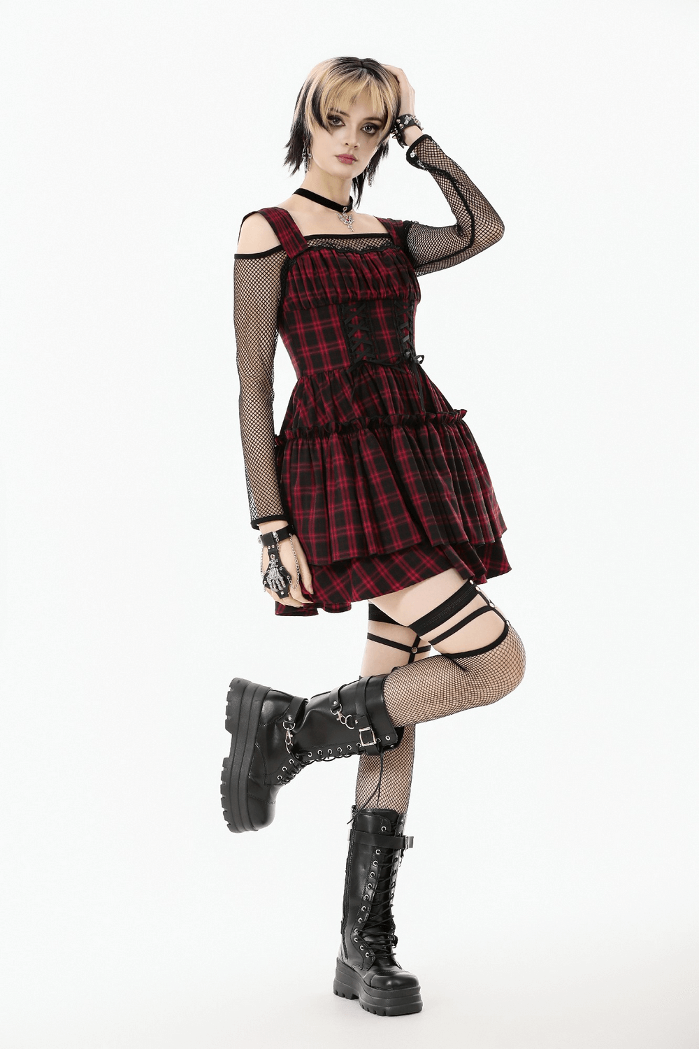Gothic Plaid Dress with Lace-Up and Ruffled Skirt showcased by model, featuring red and black plaid design, lace-up details, and ruffles.