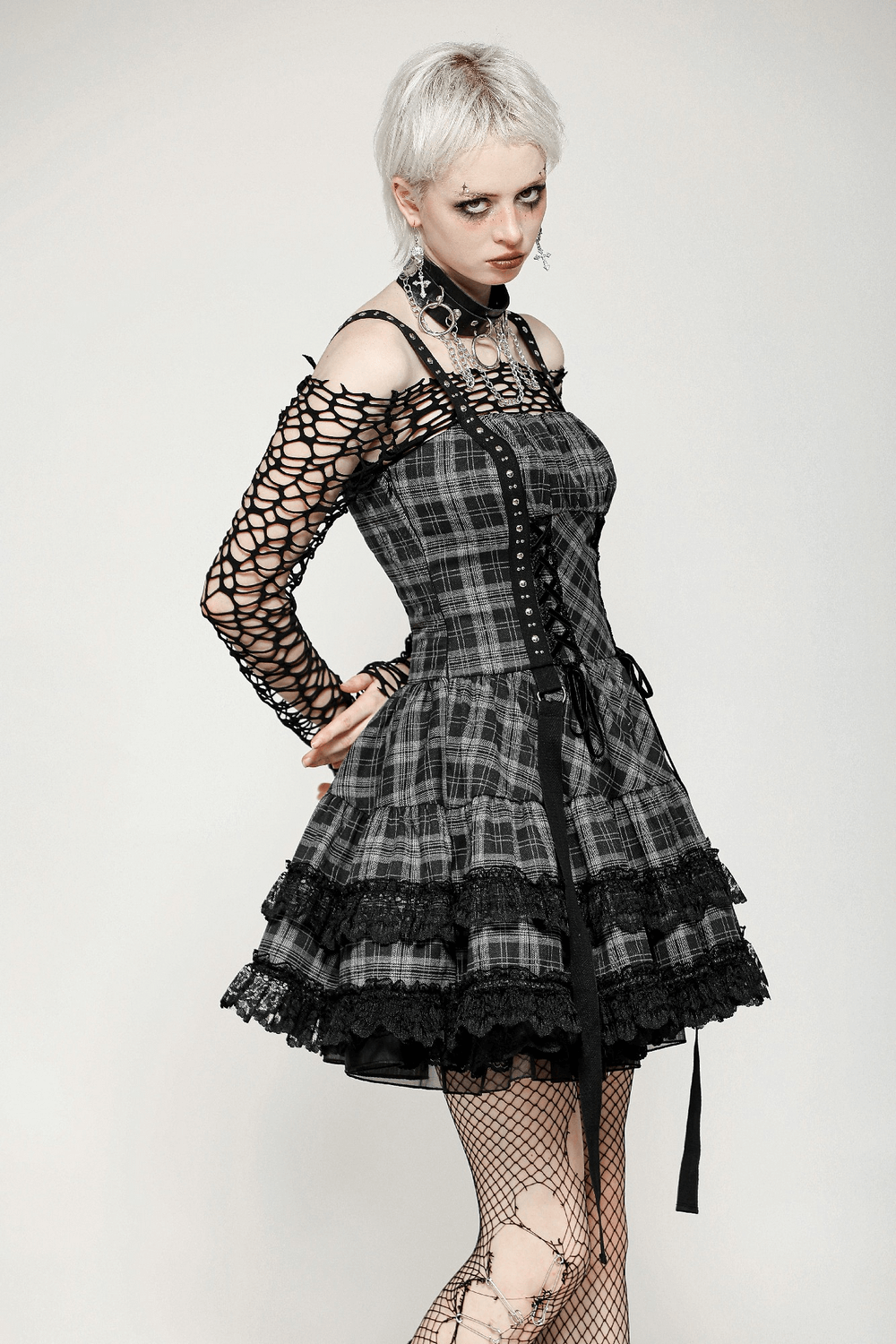 Gothic plaid mini dress with lace trim, corset lace-up, and harness straps in punk style.