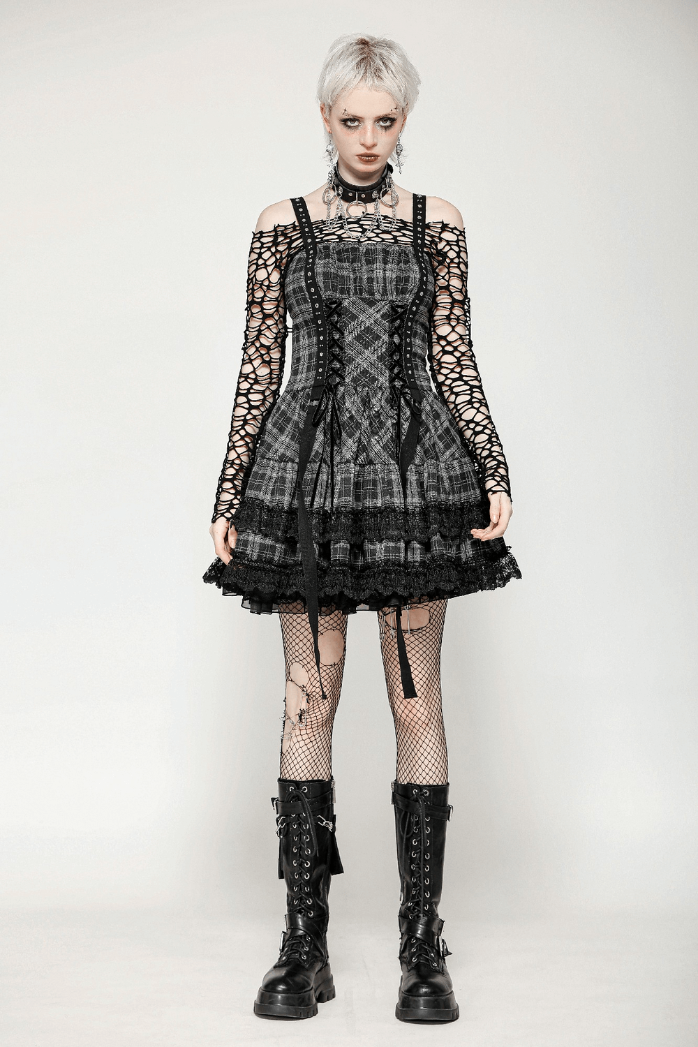 Gothic plaid mini dress with lace trim, harness straps, and ruffled skirt for punk-inspired elegance.