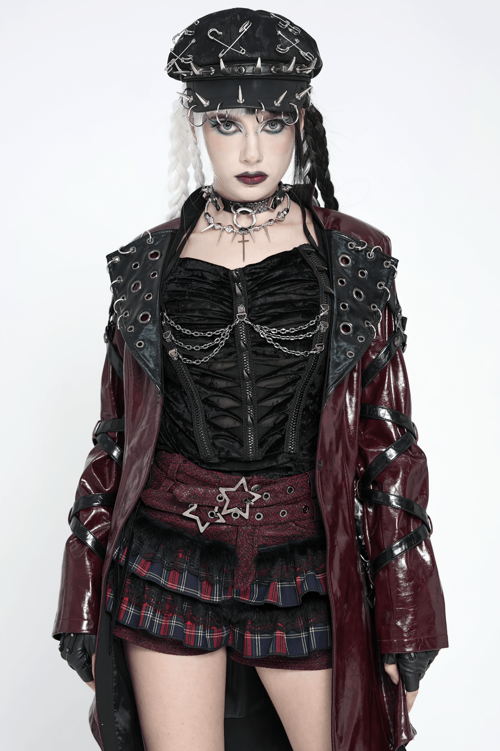 Model showcasing Gothic Plaid Ruffle Shorts with Star Belt Detail, styled with edgy accessories and a striking outfit.