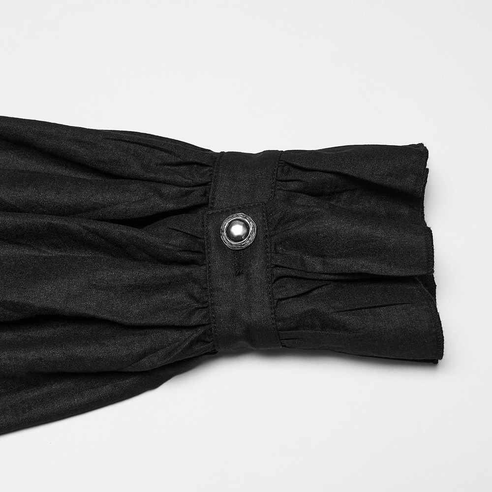 Close-up of the ruffled sleeve detail featuring a button on the Gothic Pleated Black Shirt with Stand Collar and Buckles.