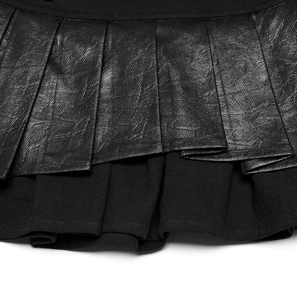 Close-up of Gothic pleated mini skirt featuring luxe faux leather and ruffled lace detailing.
