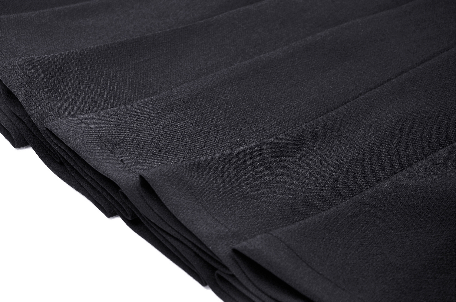 Close-up of black pleated fabric showcasing the edgy design of a gothic mini skirt.