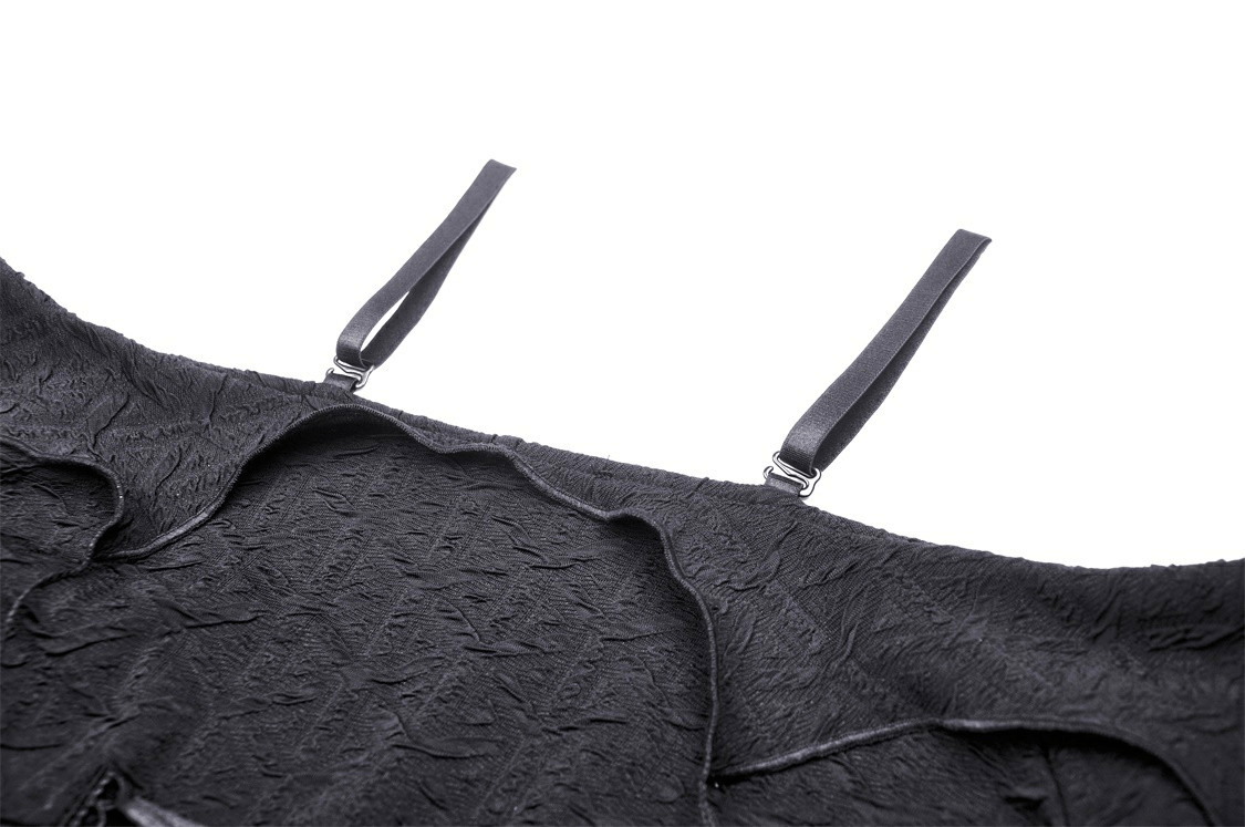 Gothic off-shoulder crop top with ruffle sleeves and dramatic pleated black fabric, showcasing intricate design details.