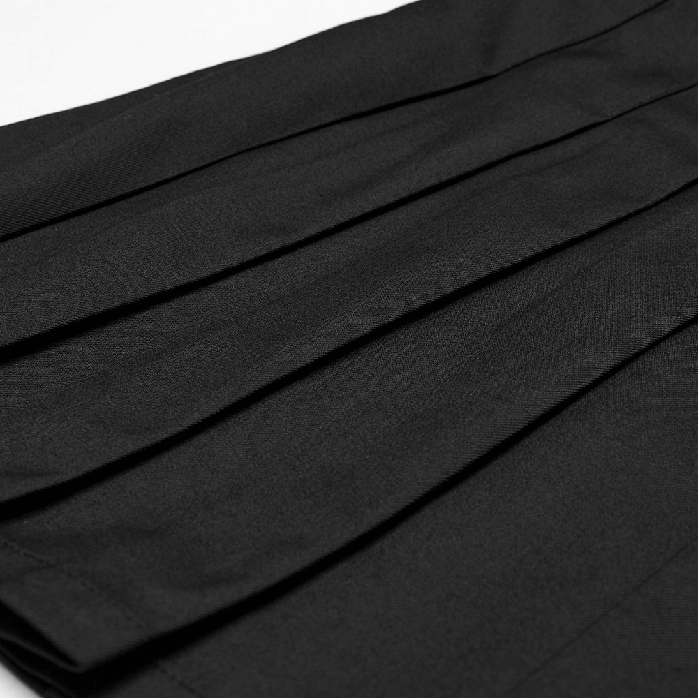 Close-up of a black pleated gothic skirt, showcasing fine fabric and elegant folds, perfect for a bold punk style.