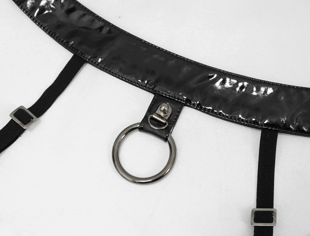 Close-up of a black PU leather halter top featuring adjustable straps and a metal ring detail.