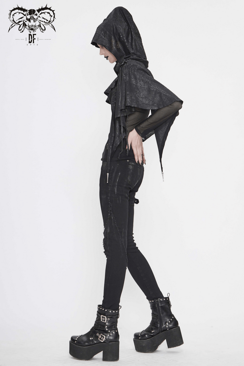 Gothic punk asymmetrical hooded cape on model, showcasing vintage black design with lace-up features and stylish platform boots.