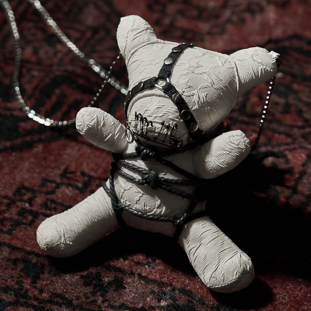 Gothic Punk Bear Plush with Chains, featuring edgy details and dark aesthetic on a textured background.