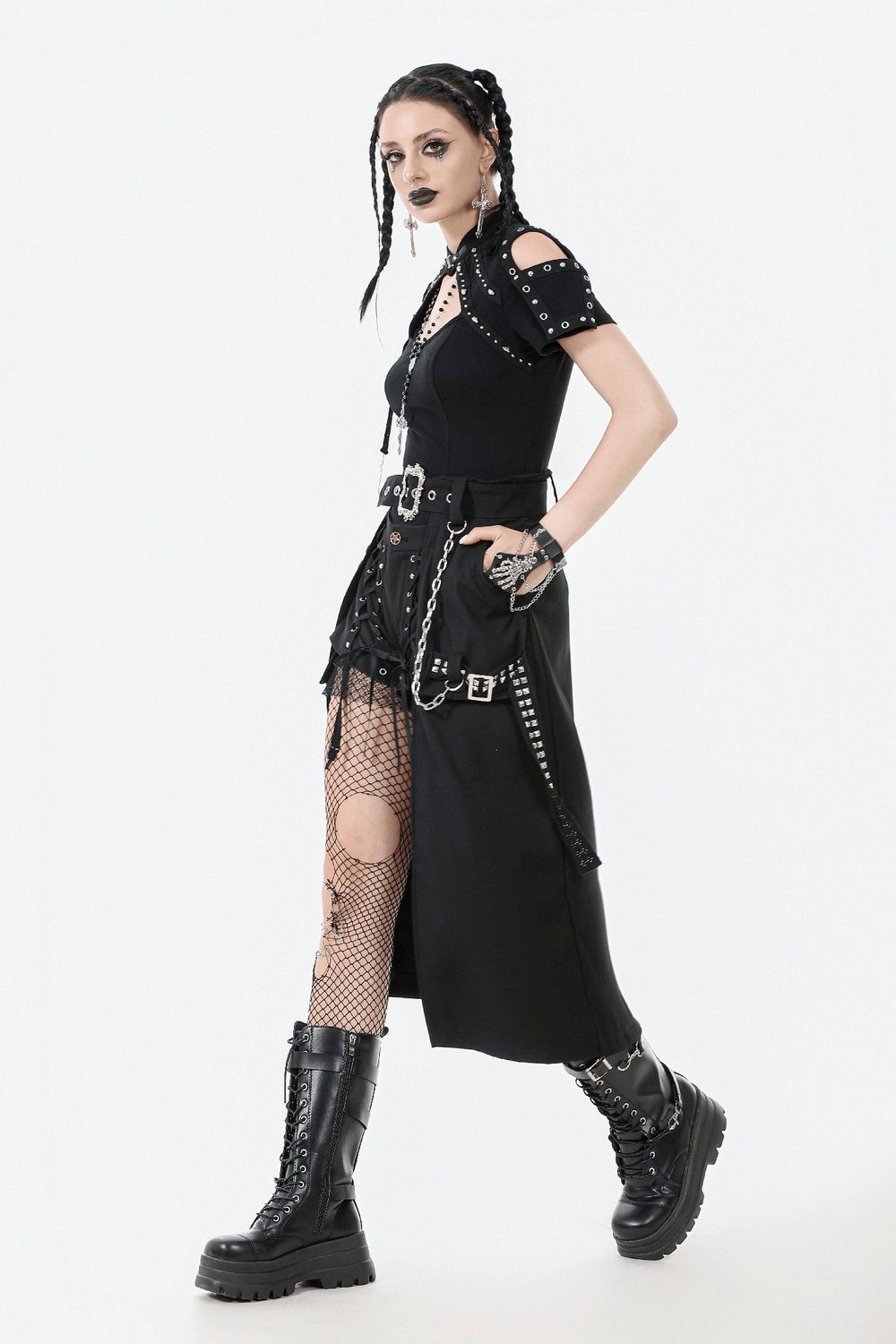 Gothic punk style model in belted skirt with chains, showcasing edgy streetwear vibes and black platform boots.